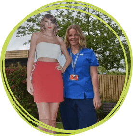 Nurse with cardboard cut out of Taylor Swift